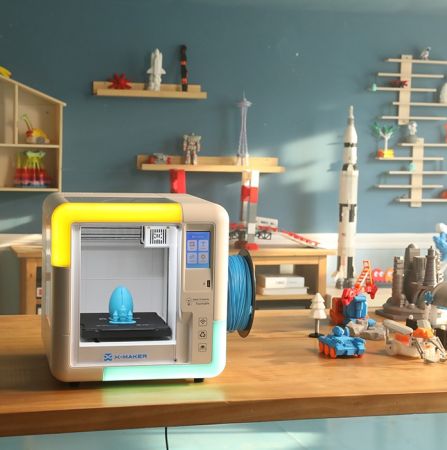  AOSeed X-Maker 3D printer for kids printing colorful toy model in educational STEM classroom