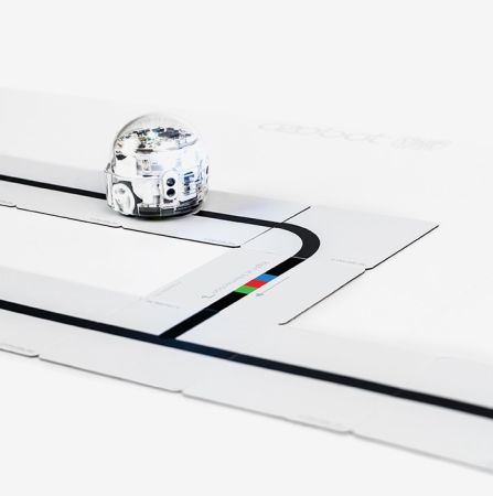 Ozobot Color Code Magnets Base Kit with white tiles and printed black tracks used for coding with Ozobot robots.