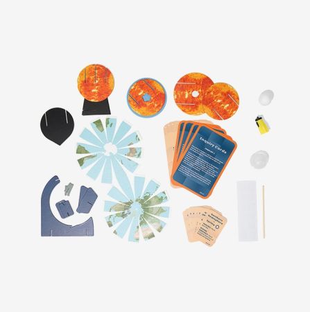 Ozobot STEAM Kit activity mat showing 3D Sun, Earth, Moon models for hands-on solar system learning and coding exploration.