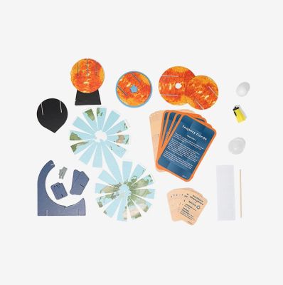 Ozobot STEAM Kit activity mat showing 3D Sun, Earth, Moon models for hands-on solar system learning and coding exploration.