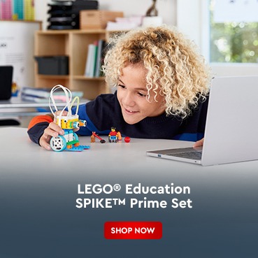 Smiling child building with LEGO Education SPIKE Prime Set for STEM learning. Available at AtlabShopOnline KSA